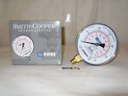 A 3 1/2 WATER GAUGE 0-300psi with durable construction and a brass connector displays measurements beside its Fire Protection Products Inc packaging, labeled FPPI, on a plain beige surface.